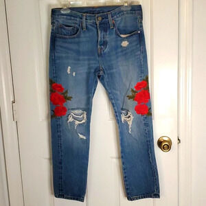 Rose Embroidered Distressed Levi Jeans with Tapered Look. 100% Cotton